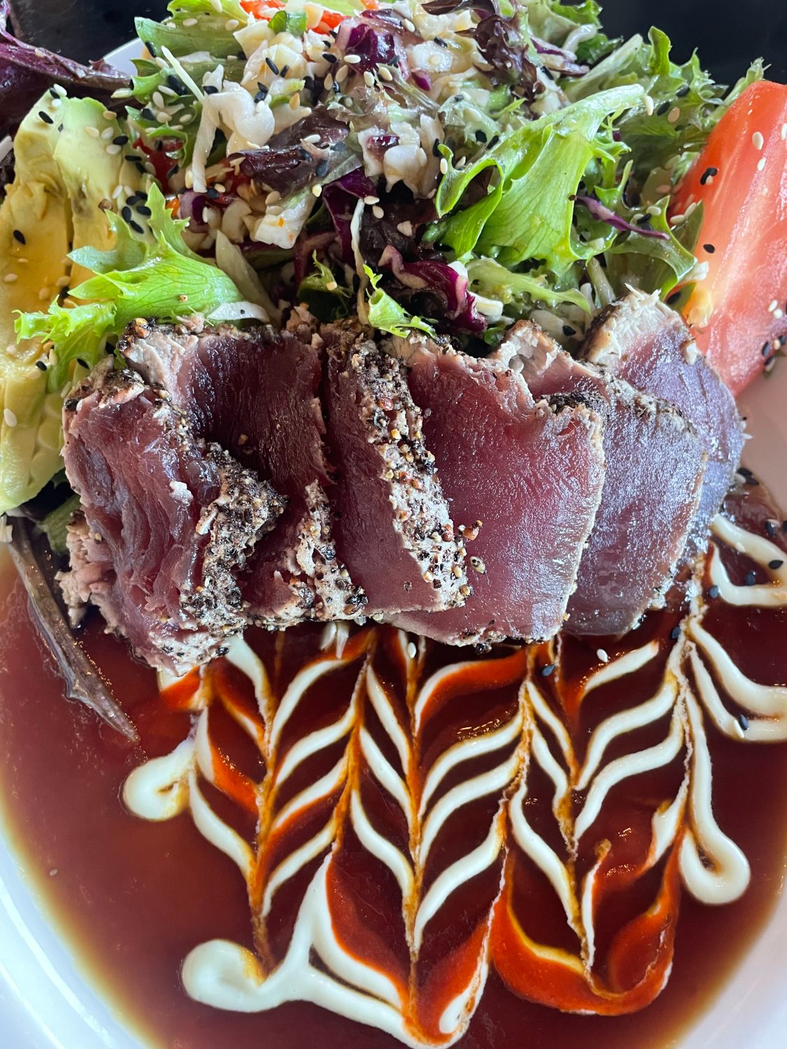 Seared tuna, sliced and plated
